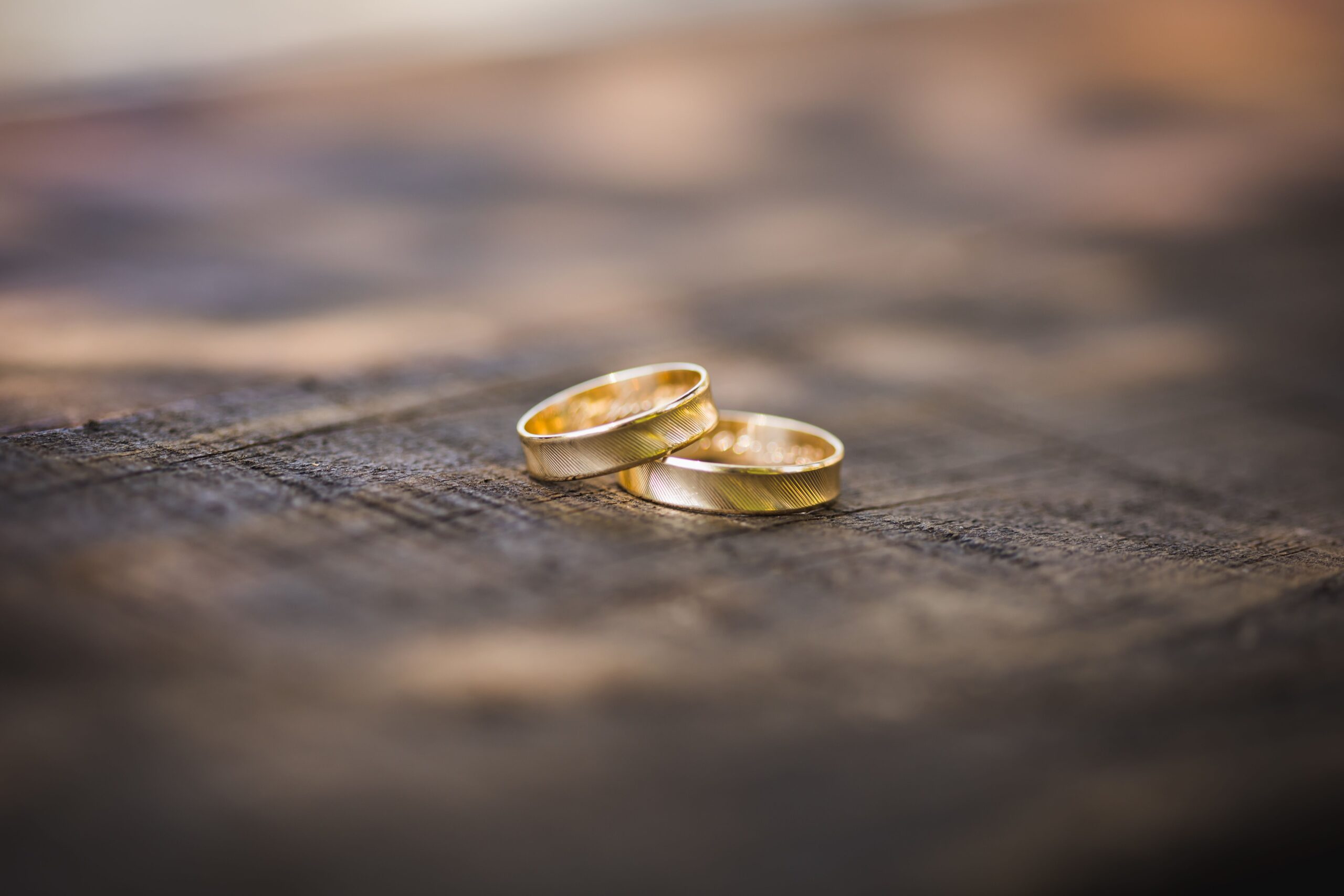 gold wedding band on black textile